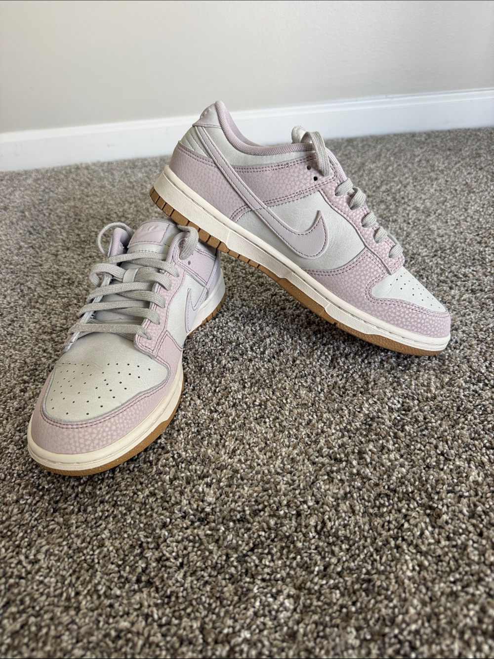 Women's Nike Dunk Low-Top Sneakers in Pale Pink.